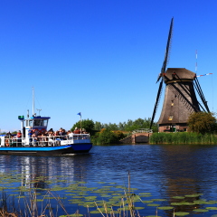 KINDERDIJK, NETHERLANDS - MAY 25, 2017 - river cruise ship docked on a canal, Kinderdijk, Netherlands
