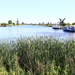 KINDERDIJK, NETHERLANDS - MAY 25, 2017 - river cruise ship docked on a canal, Kinderdijk, Netherlands