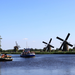 KINDERDIJK, NETHERLANDS - MAY 25, 2017 - river cruise ship docked on a canal, Kinderdijk, Netherlands