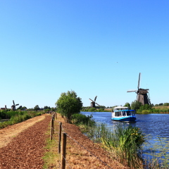 KINDERDIJK, NETHERLANDS - MAY 25, 2017 - river cruise ship docked on a canal, Kinderdijk, Netherlands
