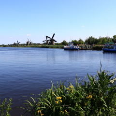 KINDERDIJK, NETHERLANDS - MAY 25, 2017 - river cruise ship docked on a canal, Kinderdijk, Netherlands