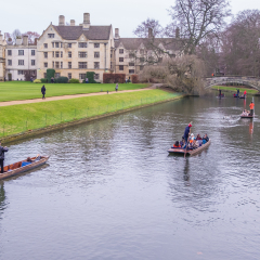 Oxford, UK - December 21, 2016 :  Unidentified people in a boat over the river  Cherwell near university of Oxford botanic gardens , Oxford, United Kingdom.