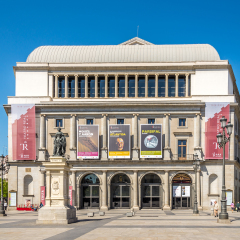 MADRID,SPAIN - APRIL 25,2016 - Royal Theater or simply El Real, as it is known colloquially, is a major opera house located in Madrid. In front is statue of Queen Isabel II.