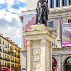 MADRID, SPAIN - MARCH 22, 2016:  Isabel II sculpture in front of Theater Real (architect Antonio Lopez Aguado, Custodio Teodoro Moreno, 1850) is a major opera house located in Madrid.