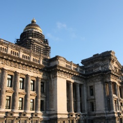 Monumental architecture landmark in Brussels, Belgium. Justice Palace (Palais de Justice). Eclectic and neoclassical style building in sunset light.