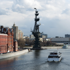 Moscow, 26/04/2017: one of the many cruises on the Moskva River and view of Peter the Great Statue, a 98-metre monument made in 1997 by Zurab Tsereteli to commemorate the 300 years of the Russian Navy