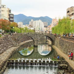 NAGASAKI - DEC,4:The nice view of the Meganebashi Bridge or Spectacle Bridge that was built in 1634.It's the oldest stone arch bridge in Japan. There are many tourists visiting here.JAPAN DEC,4 2016