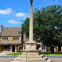 BROADWAY, UNITED KINGDOM - JUNE 12, 2014 - Stone war memorial in the village centre, Broadway, Cotswolds, Worcestershire, England, UK, Western Europe, June 12, 2014.