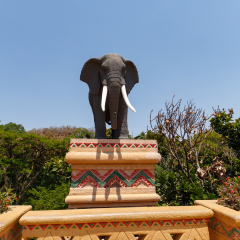 SUN CITY, SOUTH AFRICA - OCTOBER 29: Gigantic elephant statues on fluttering Bridge of Time in famous resort on 29 October in Sun City, South Africa