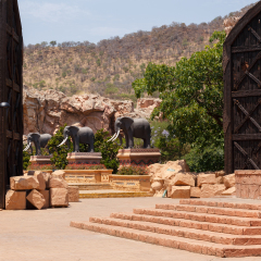 SUN CITY, SOUTH AFRICA - OCTOBER 29: Gigantic elephant statues on fluttering Bridge of Time in famous resort Lost City on 29 October in Sun City, South Africa