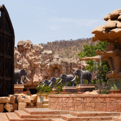 SUN CITY, SOUTH AFRICA - OCTOBER 29: Gigantic elephant statues on fluttering Bridge of Time in famous resort on 29 October in Sun City, South Africa
