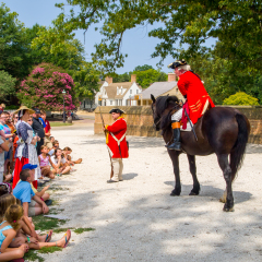 WILLIAMSBURG, VA - August 17, 2010: An actor playing Benedict Arnold, with crowd in attendance, at Colonial Williamsburg in Virginia.