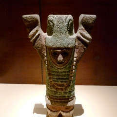 Mexico City, D.F, Mexico - January 2013: Anthropomorphic Toltec miniature sculpture used as support pillars for small altars, incense burners, or throne seats in the National Museum of Anthropology.