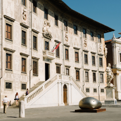 Pisa, Italy - August 26, 2016: Palace of Scuola Normale Superiore of Pisa in the square of the knights