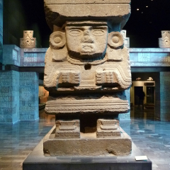Mexico City, Mexico - January 2013: The monolithic statue of Chalchiuhtlicue, goddess of terrestrial water and wive of Tlaloc in the Teotihuacan Hall in the National Museum of Anthropology.