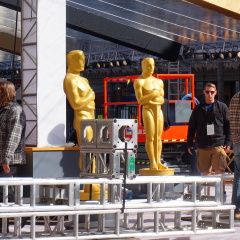 LOS ANGELES, FEB 23RD, 2017: Workers surround two Oscar statues in the red carpet area for the 2017 Academy Awards.
