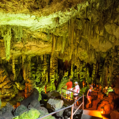 CRETE,GREECE-JULY 21: Tourists go sightseeing in the Cave of Zeus on July 21,2014 on the Crete island in Greece.