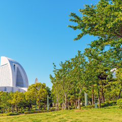 YOKOHAMA, JAPAN - MAY 18: Yokohama MM21 in Rinko-Park, Yokohama, Japan on May 18, 2014. MM 21 is a large urban development, and the central business district of Yokohama, Japan. 