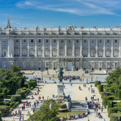 Madrid, Spain. March 17, 2017. Tourists gathering around Prince's Gate of Royal Palace (Palacio Real) and Monument to Philip IV in Plaza de Oriente Square