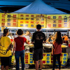 TAIPEI, TAIWAN - JULY 14: Hungry crowds eat at the Shilin Night Market food court in the Shilin District of Taipei July 14, 2013. Shilin Market is the most popular and largest night market in Taiwan.