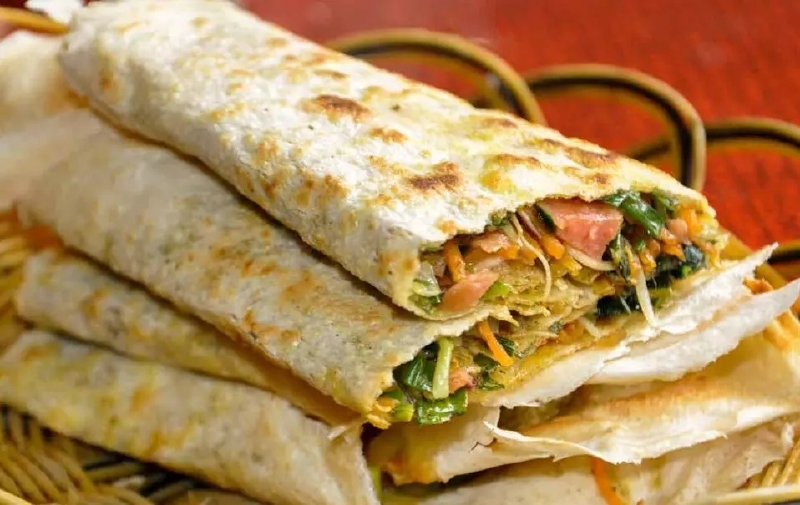 "人生,就像在枣庄台儿庄吃了一个塌菜煎饼