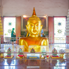 Phuket, Thailand - March 23, 2017: Golden Buddha statue at Pratong temple or Phra-phud temple in Phuket, Thailand