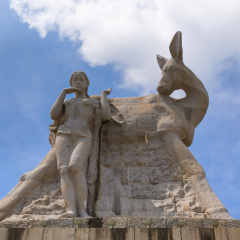 SANYA - JUL 17, 2016: Statue of girl and deer in Luhuitou Park, Sanya, Hainan province, China