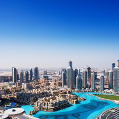 DOWNTOWN DUBAI, UAE - MAY 7 - The Dubai Fountain is set on the 30-acre manmade Burj Khalifa Lake. 63-storey, 302.2 m Address Hotel is visible on the left. Picture taken on May 7, 2010.