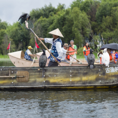 DALI, CHINA - MAY 16: People fishing on Erhai lake near Dali, Yunnan province, China on May 16 2014. Fishermen are Bai, a minority ethnic, and they use birds to fish.