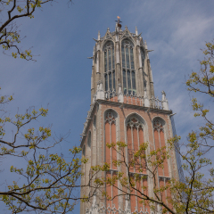 Dom Tower Recreates The Netherlands By Displaying Real Size Copies Of Old Dutch Buildings With Beautiful Sky In Huis Ten Bosch Theme Park,Sasebo,Kyushu,Japan;