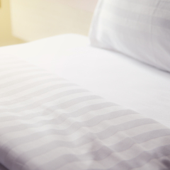 quilt bed  white pillows on white bed in bedroom