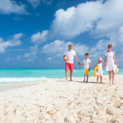 Happy beautiful family on a Caribbean holiday vacation