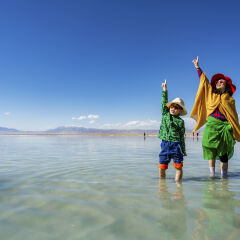 The mother and son standing in the Chaka Salt Lake