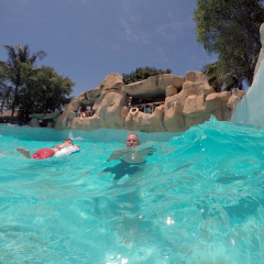 NHA TRANG, VIETNAM - CIRCA MARCH 2014: People in a wave pool at a waterpark on an island across from Nha Trang
