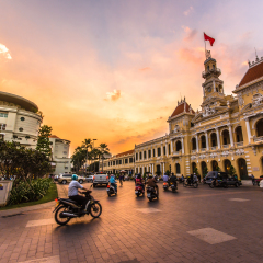 HO CHI MINH CITY,VIETNAM - DEC 10: Traffic in front of Ho Chi Minh City Hall at twilight on December 10,2015 in Ho Chi Minh City,Vietnam.