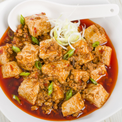 Mapo Tofu - Tofu and minced pork cooked with chili bean paste, fermented black beans, chili oil and Szechuan peppers, garnished with spring onions. 