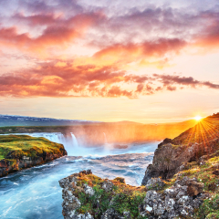 The picturesque sunset over landscapes and waterfalls. Kirkjufell mountain, Iceland
