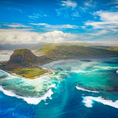 Aerial view of the underwater waterfall and Le Morne Brabant peninsula. Amazing Mauritius landscape