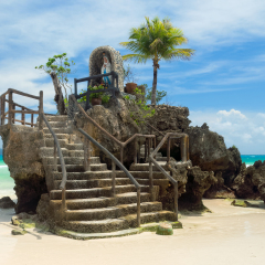 Willys Rock, situated on the famous White Beach, is one of the most recognizable landmarks of Boracay Island, Philippines