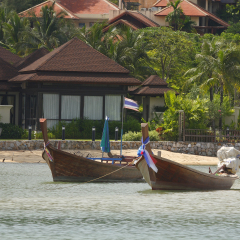 A view of Bang tao beach wit longtailboats, on the exotic island of Phuket in Thailand
