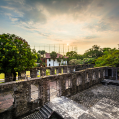 Sunset over the ruins of the walls at Fort Santiago, in Intramuros, Manila, The Philippines.