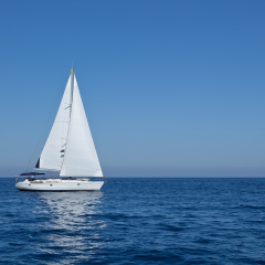 Racing yacht in the Mediterranean sea on blue sky background