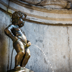 Manneken Pis (Little man Pee) or le Petit Julien, a landmark small bronze sculpture in Brussels, Belgium