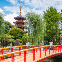 JUNE 27, 2014 - Kawasaki, Japan : Five story pagoda and red bridge of Kawasaki Daishi Temple, Kawasaki, Japan