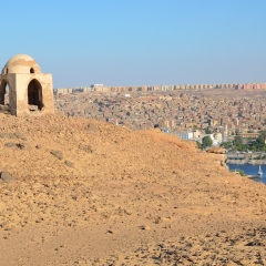 ASWAN, EGYPT â?? DECEMBER 1 2015: Qubbet el-Hawa known as the dome of the wind is a small dome like structure situated on the top of the sand hill that houses the noble tombs. 