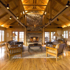 Living room and stone fireplace in cabin