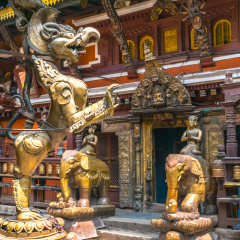 golden decoration fugures in a holy hindu temple in patan. kathmandu. nepal