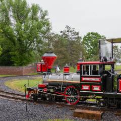 UPPER CANADA VILLAGE, MORRISBURG, ONTARIO, CANADA - JUNE 11, 2016: The Moccasin miniature train for tourists on Farran's Point Station.