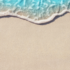 Soft Wave Of Blue Ocean On Sandy Beach. Background. Selective focus.