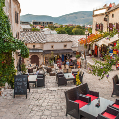 Mostar, Bosnia and Herzegovina - October 01, 2010: The promenade, with many cafes and shops, Mostar